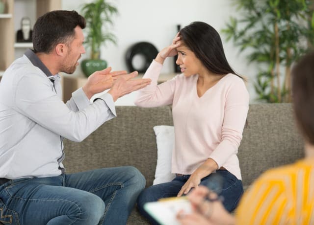 Couple having an argument during a therapy session 