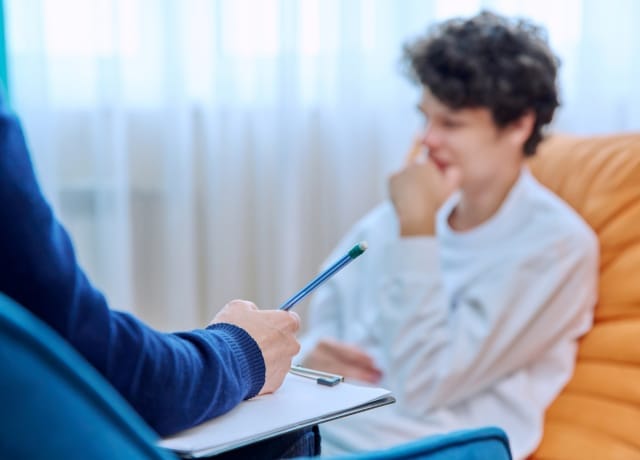 -psychiatrist-talking-young-male-client